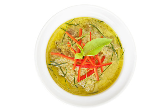 Green curry in bowl isolated on white