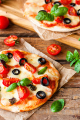 pizza with tomatoes, mozzarella and basil