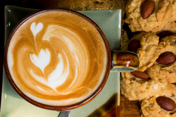 A cup of coffee with butter almond cookies