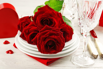 Red roses on holiday served table