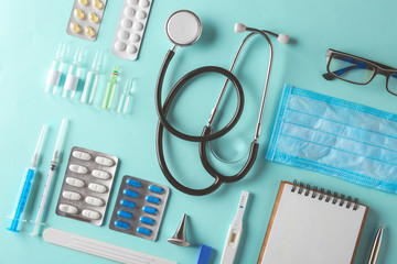 Doctor table with medical items. Flat lay