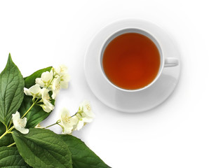 Cup of tea with jasmine flowers on white background
