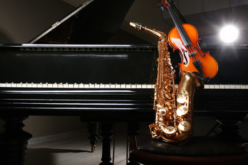 Violin with saxophone and piano, closeup