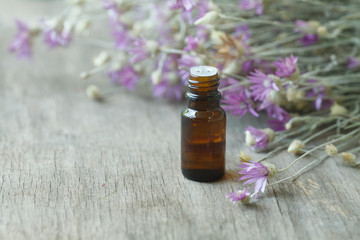 Fototapeta na wymiar Helichrysum essential oil container