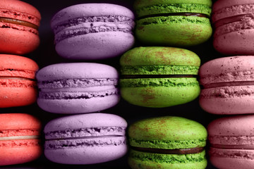 Different colorful macaroons background