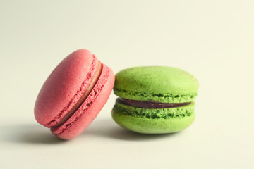 Colorful tasty macaroons on white background