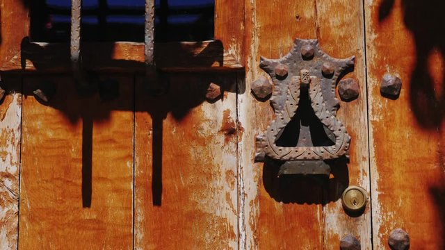Door handle on an ancient door. In the town of Rupit, Spain