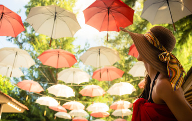 Female tourist marvels at baldachin of umbrellas © Kzenon