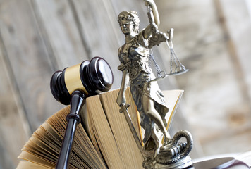 Law concept. Gavel, statue and book