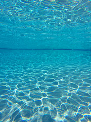 Light Patterns Underwater in cCean Empty Swimming Pool