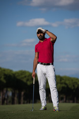 handsome middle eastern golf player portrait at course