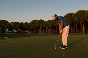 Fototapeta premium golfer hitting shot at golf course