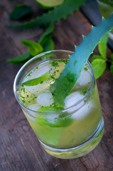 Aloe vera and lime cocktail with mint and ice cubes