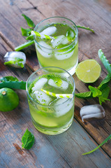 Aloe vera and lime cocktail with mint and ice cubes
