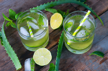 Aloe vera and lime cocktail with mint and ice cubes