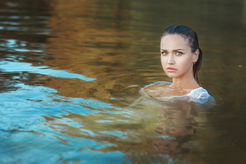 Portrait of a woman in water.