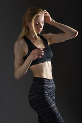 Beautiful sexy blonde woman perfect athletic slim figure engaged in yoga, exercise or fitness, lead healthy lifestyle, eats right, dressed in comfortable casual clothes sport pilates diet body shape