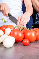 Beautiful young couple in the kitchen