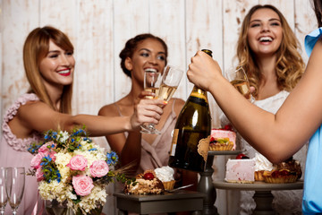 Four beautiful girls resting at party.