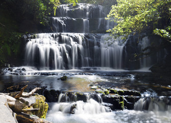 A long exposure shot of Purakaunui Waterfall.