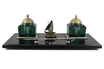 Set of a retro of inkwells on a support snozhy for paper cutting