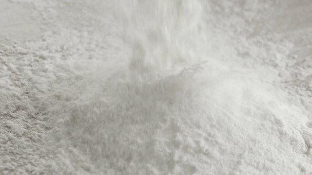 Scattered dry flour on a kitchen counter top