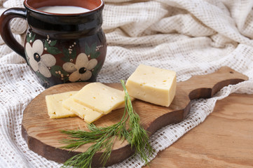 Zavtrak.Syr, dill and jug of milk