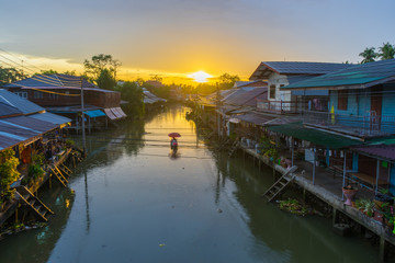 Floating market at sunrise in Amphawa, Samut Songkhram Province, Thailand