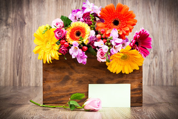 Mixed flowers on wooden background