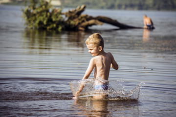 Boy in water summer