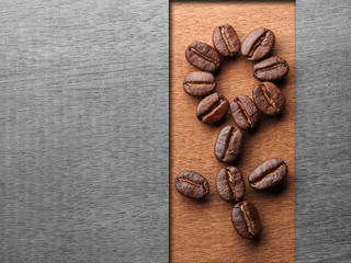 Coffee crop beans on wood texture