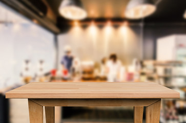 wooden table with cafe background
