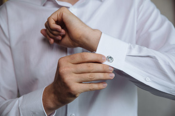 Businessman hands with cufflinks. Elegant gentleman clother
