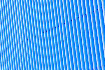 Obraz premium Detail of blue striped metal facade for background