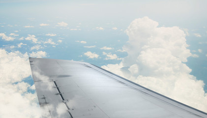 Fototapeta na wymiar Airplane wing out of window . Mixed media