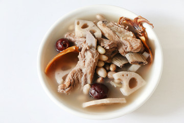 Chinese traditional Pork rib soup with lotus root, dried squid and red dates