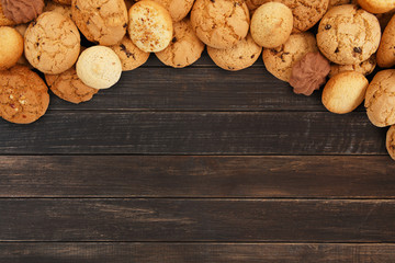 Cookies and biscuits at brown wood with copy space