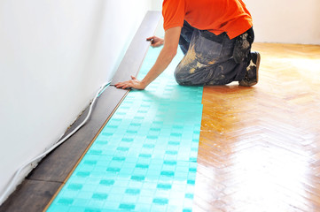 Carpenter doing laminate floor work