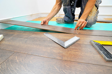 Carpenter doing laminate floor work