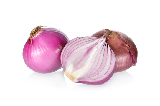 whole and half cut red onion or shallot on white background