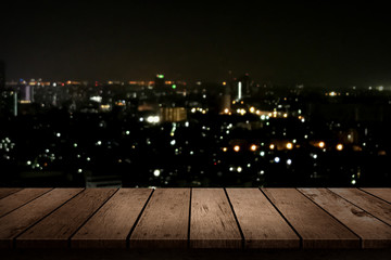 wood table top on night city background