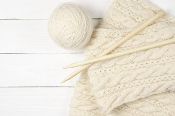 Woolen knitting on wood