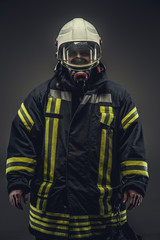 Portrait of firefighter in oxygen mask.