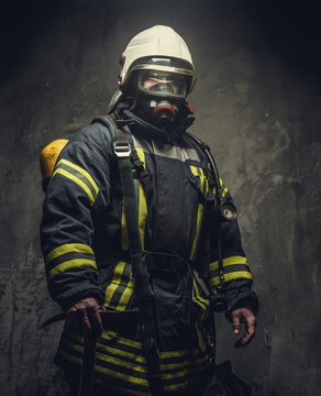 Portrait of firefighter in oxygen mask.