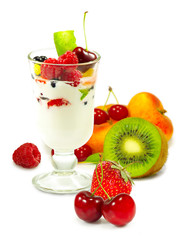 isolated image of yogurt in a glass with fruit on a white background close up