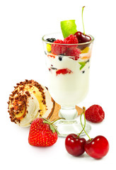 isolated image of yogurt in a glass with fruit on a white background close up
