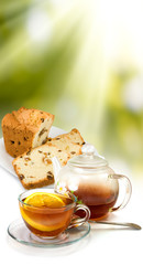 image of cups with tea, ñàêå and lemon on sunlight background