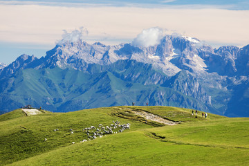 View from Monte Baldo. Tourists go on hike along ridge of mounta