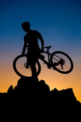 Obraz premium Mountain biker silhouette