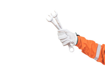 Mechanic holding pair of wrenches on white background